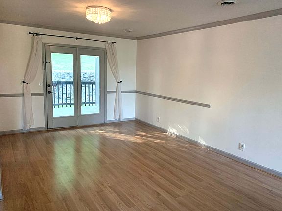 Dining area w/ doors to deck.