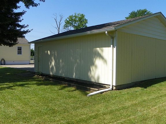 Yard behind house and garage