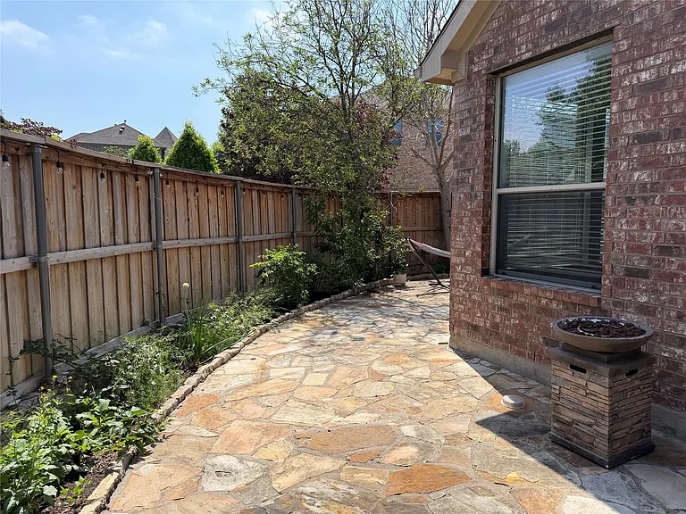 Low maintenance backyard perfect for relaxing with a coffee and a great book.