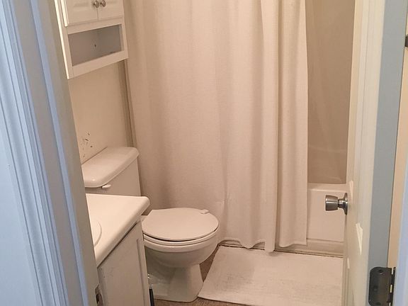 2nd floor full bath. Outdated photo - bathroom now has new white vinyl.