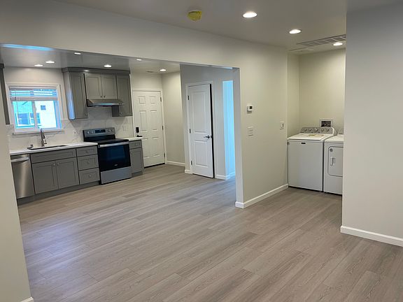 open living/dining area to kitchen