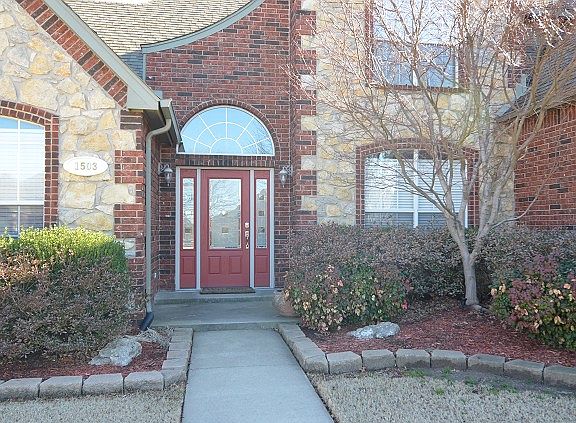 Family room has a magnificent fireplace
