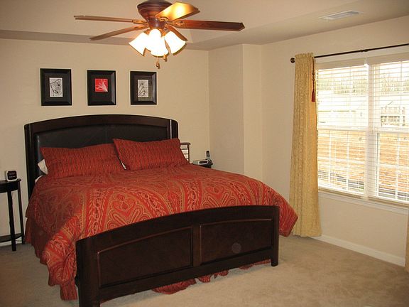 Master bedroom with deep treyed ceiling.