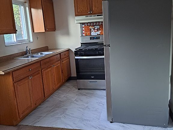 equip kitchen with stainless appliances and gas range