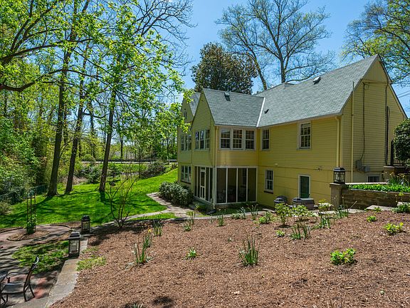 Rear view of home showing screened porch