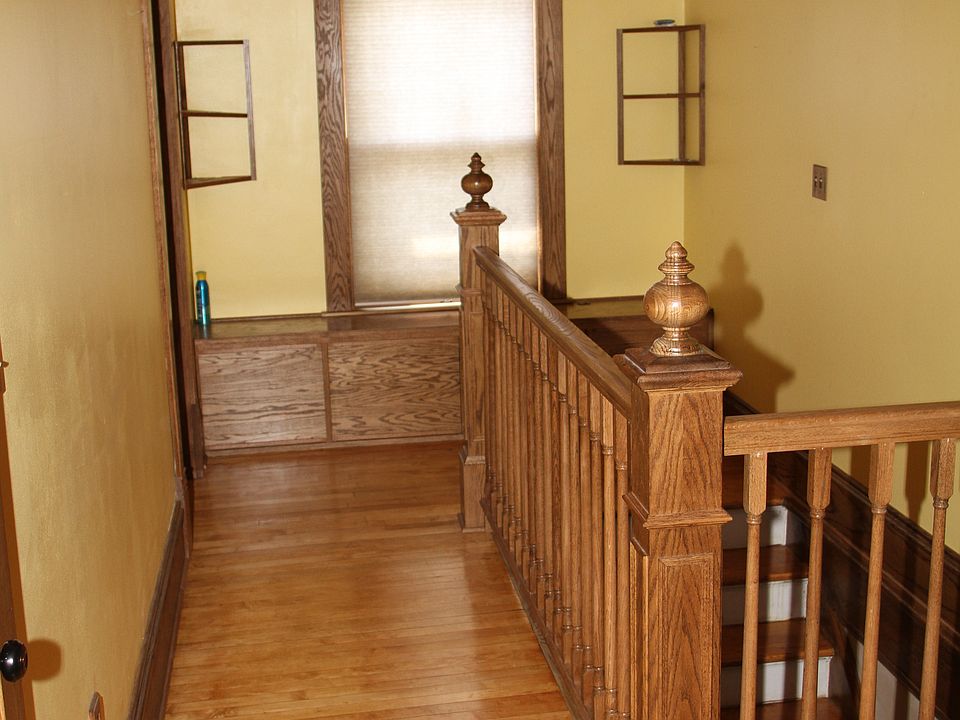 Upstairs hallway with natural woodwork throughout