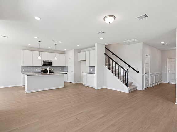 The Oriole II- Family Room into Kitchen