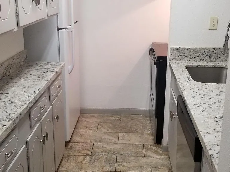 Granite Kitchen Counter-tops & Large Tile Flooring