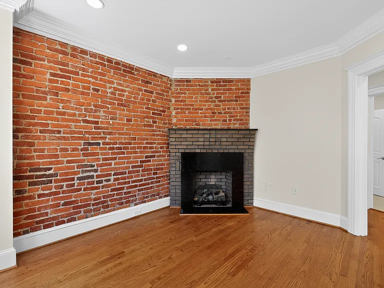 Luxurious gas burning fireplace with beautiful Italian marble trim