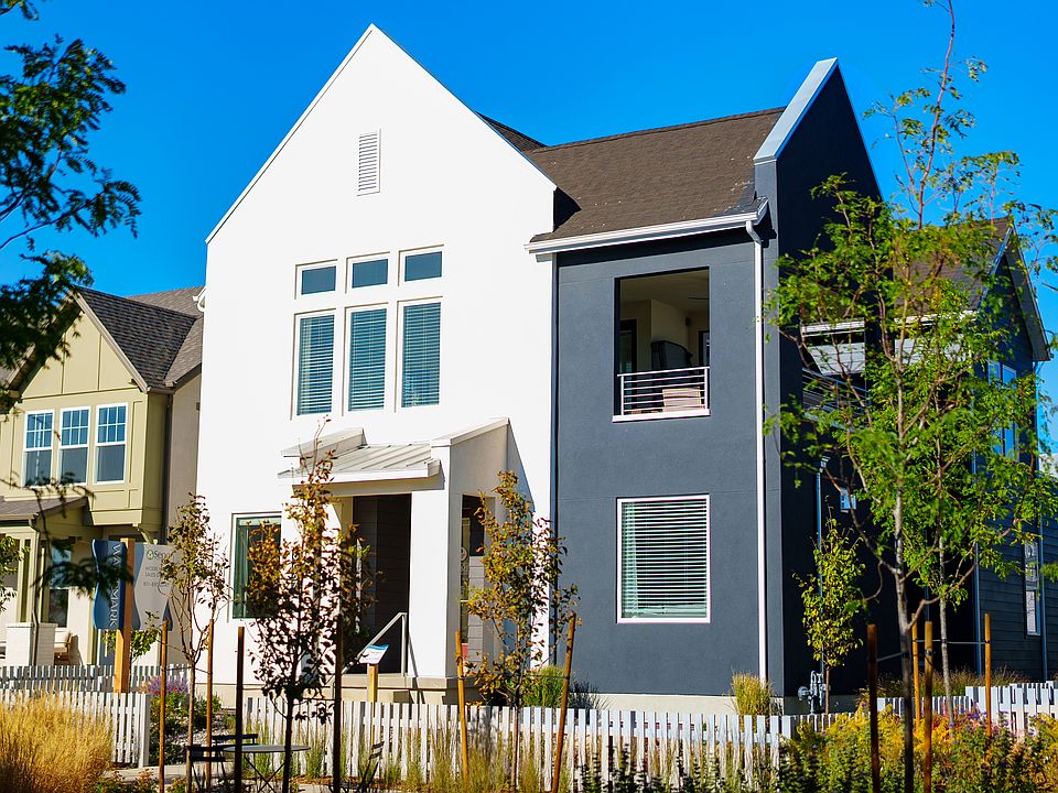 Modern two-story house from the Contempo Collection with white and dark gray exterior, large windows