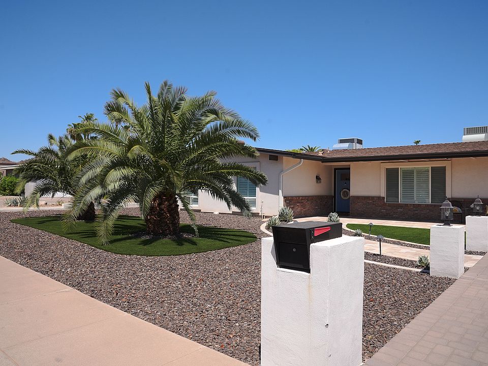Front view of house with low maintenance desert landscaping