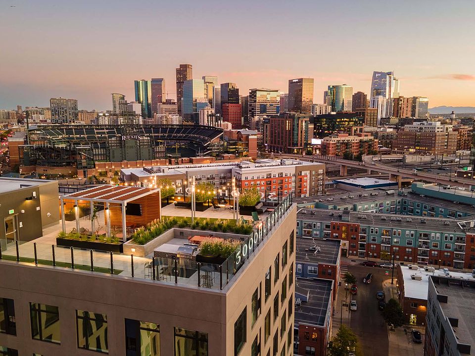 Enjoy stunning rooftop views with a vibrant cityscape backdrop.