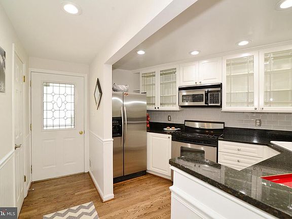 Front door, foyer and kitchen