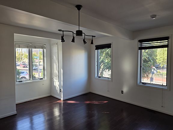 Living room view out through bay and front windows.