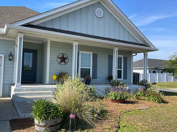 Front porch overlooks retention pond.
