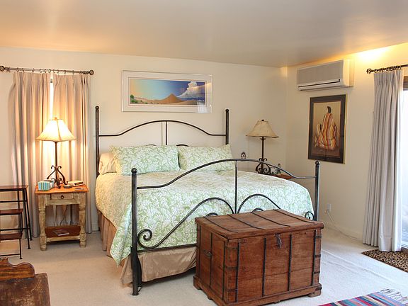 King master suite with patio doors open to upstairs deck