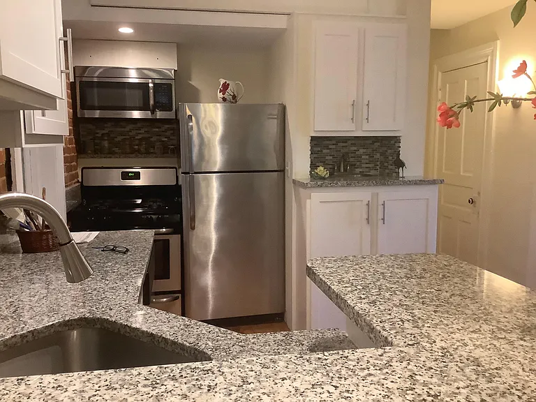 Granite counters as well as the refrigerator stove microwave and also the bar sink.