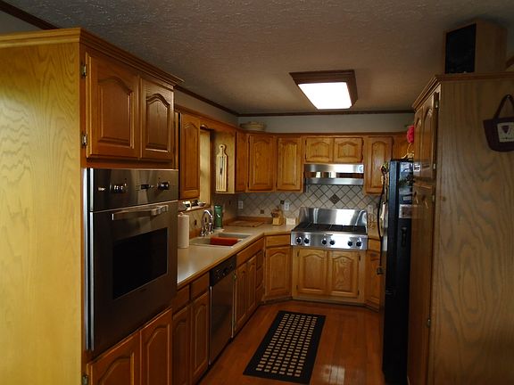 Kitchen, SS & Solid Oak Cab.