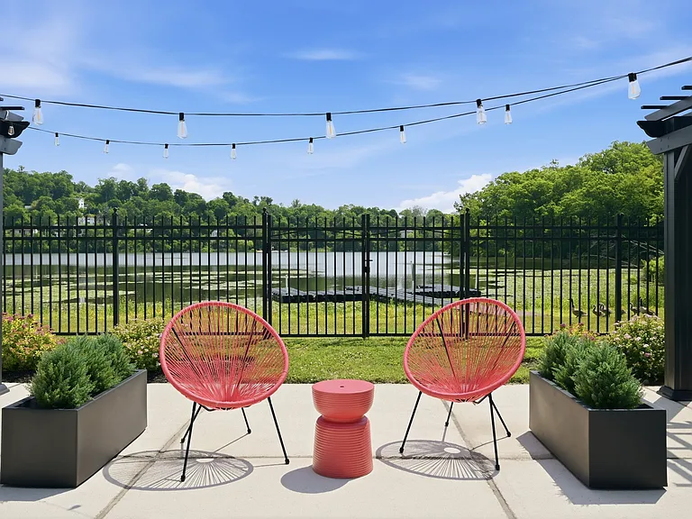 Unwind in style at Eagle Rock Apartments at Mohegan Lake. Enjoy serene views and cozy seating on your private patio, perfect for relaxation. Embrace the lakeside lifestyleschedule your visit today!