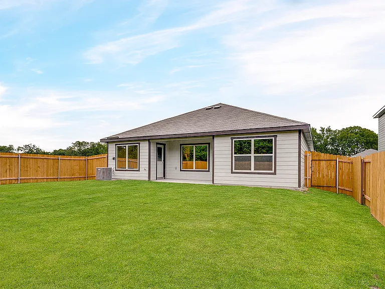 The back yard is fully fenced-in.