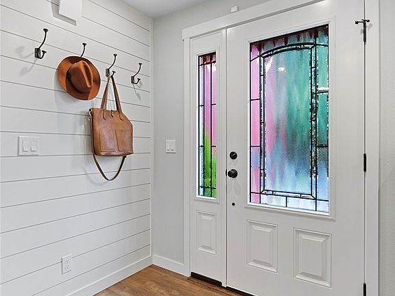 Front Entry with Shiplap Feature wall and Restoration Hardware Coat Hooks.