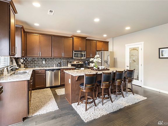 Kitchen with huge island and ample counter space. 
