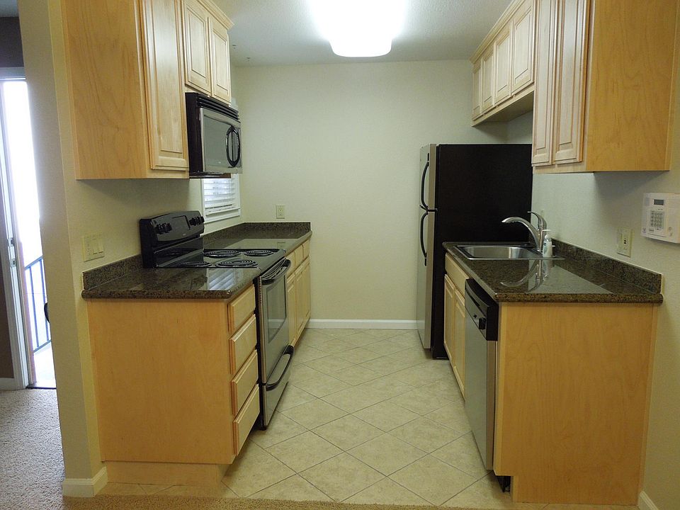 All appliances have stainless steel finish. Microwave above electric stove. Refrigerator, sink with new pull out faucet, dishwasher. Tile floors.