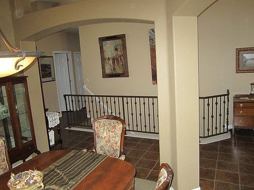 view from dining room to lower level stairs