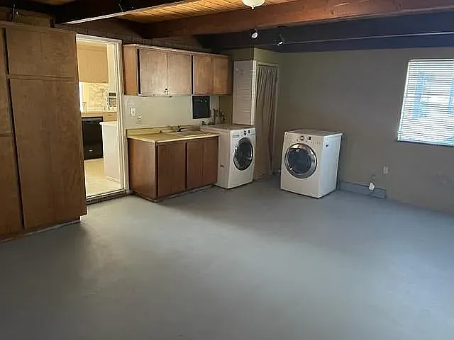 Bonus Room / Laundry Area / Office / Storage with exit to side deck