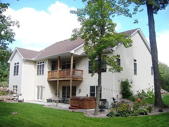 Back of the home. Sits on a privately wooded 1.58 acre lot.