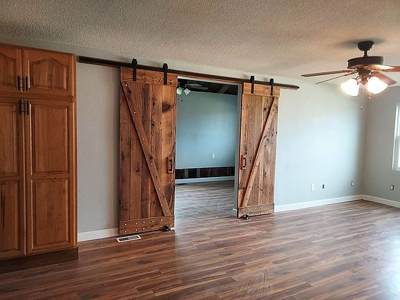Living rm w custom barn door