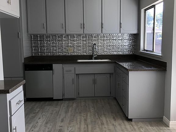 Kitchen with dishwasher ample counter area.