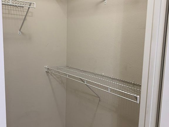 Larger bedroom walk-in closet