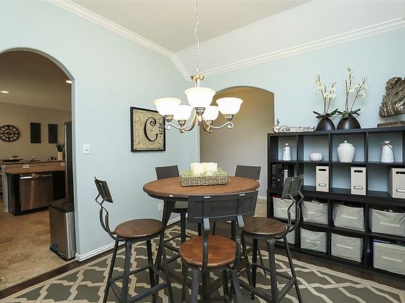 This room opens up to the Entry AND kitchen!