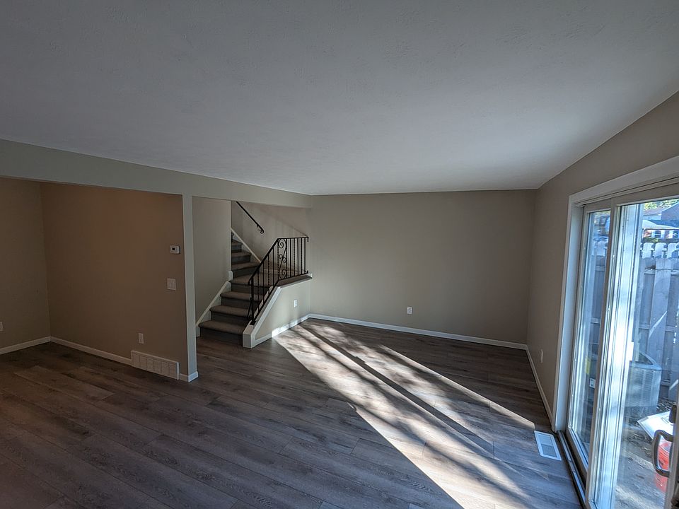 Living room with sliding glass door out to private porch