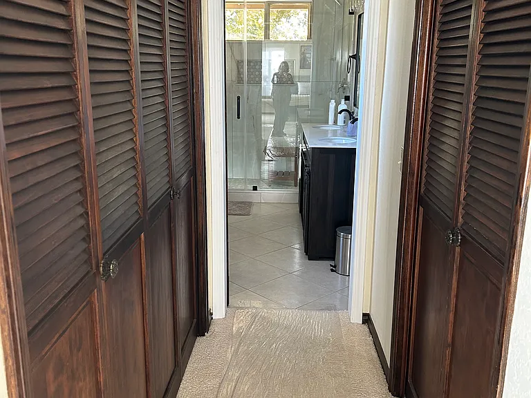 Hallway from Master Suite to the bathroom. More closet space!