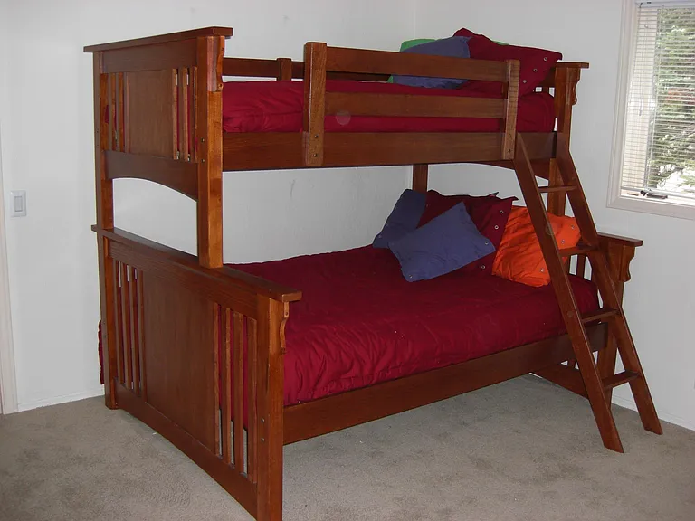 Downstairs bedroom has twin over full bunk, desk, dresser