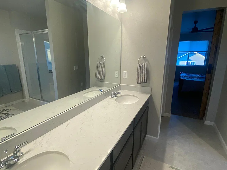 His and her sinks in owner's bath