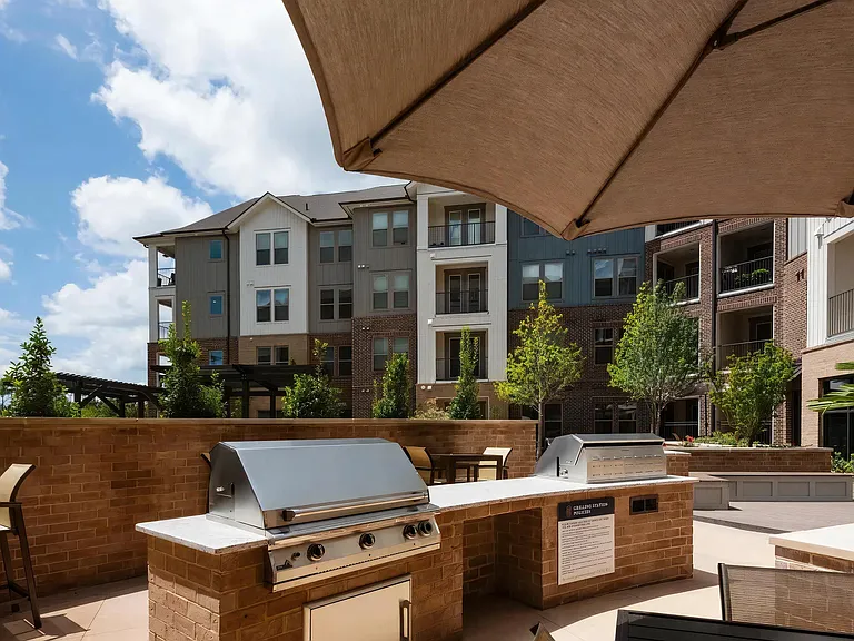 Dual Community Grilling Stations in Outdoor Kitchen Setting