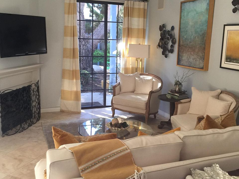 Spacious Living Room with Gas Fire Place and patio access to ponds and streams