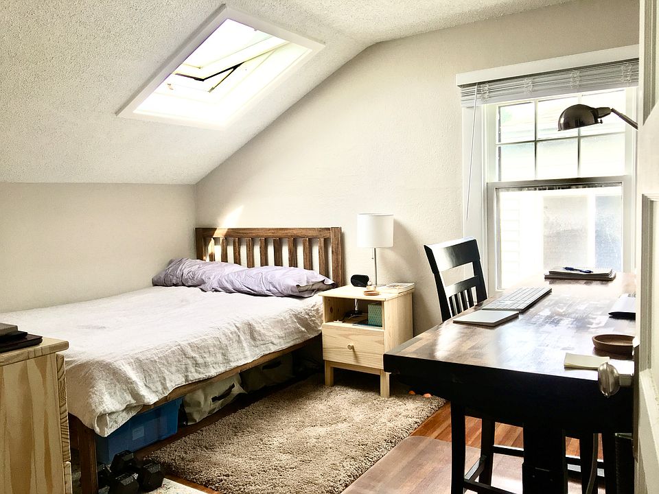 The room: All furniture will be different and there is now a built-in bookshelf spanning the whole short wall.
