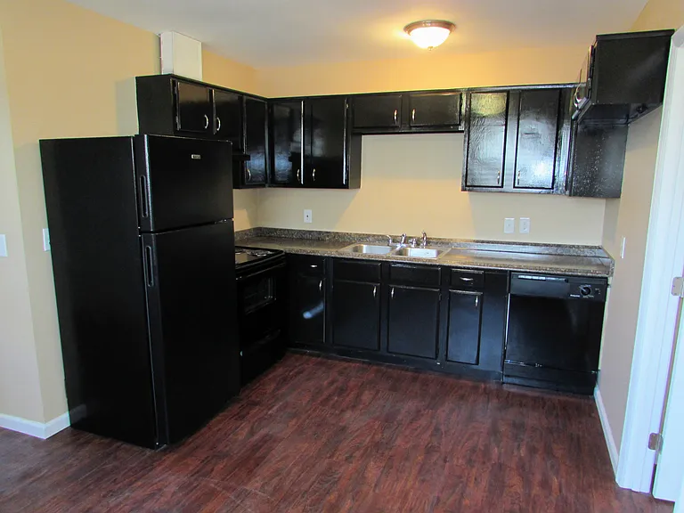 Open kitchen that includes a dishwasher