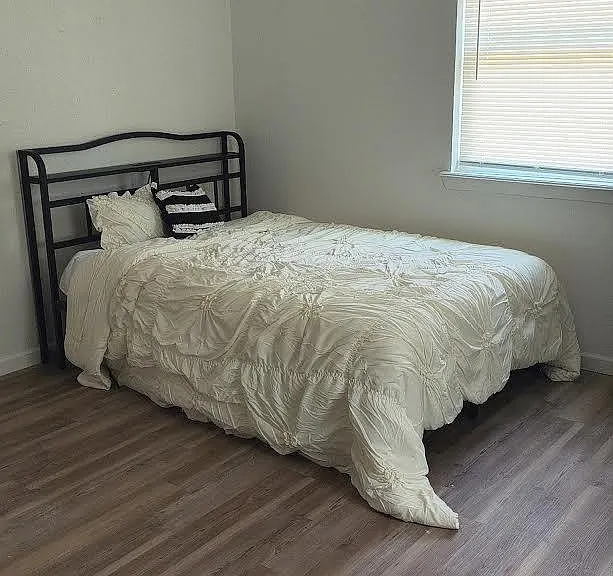 Full bed with headboard charging station. Mattress topped with mattress pad only)
