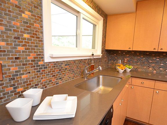 Kitchen with cool inlaid tile backsplash
