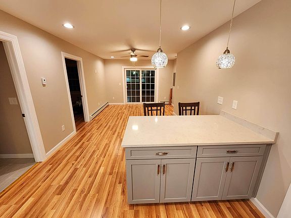 Quartz island countertop. Elegant kitchen lights to change your entire mood for lighting.