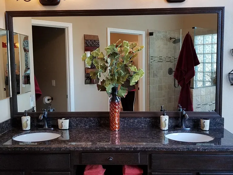 Master bath with two sinks, shower, deep soaker tub, private toilet room, walk-in closet