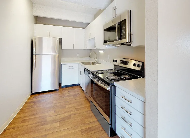 Upgraded stainless steel appliances, quartz countertops, and new cabinets