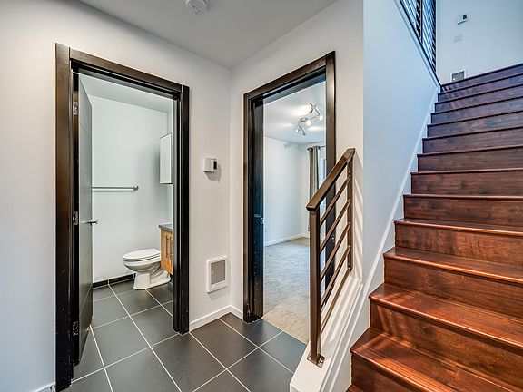 Entry Level full Bath and door to lower level bedroom