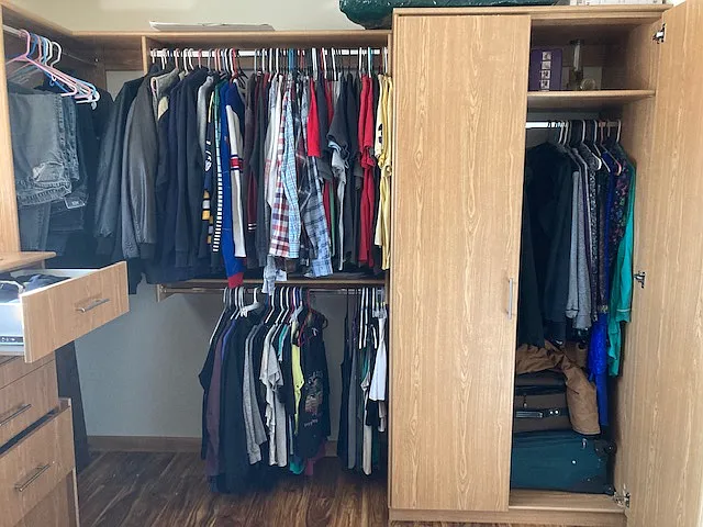 Master closet has hanging space for longer clothes & double- hung rods.