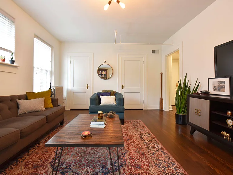 Spacious living room with hardwood-style flooring